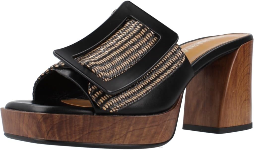 Pavo Monitor Arm installed on a wooden desk with cables neatly managed